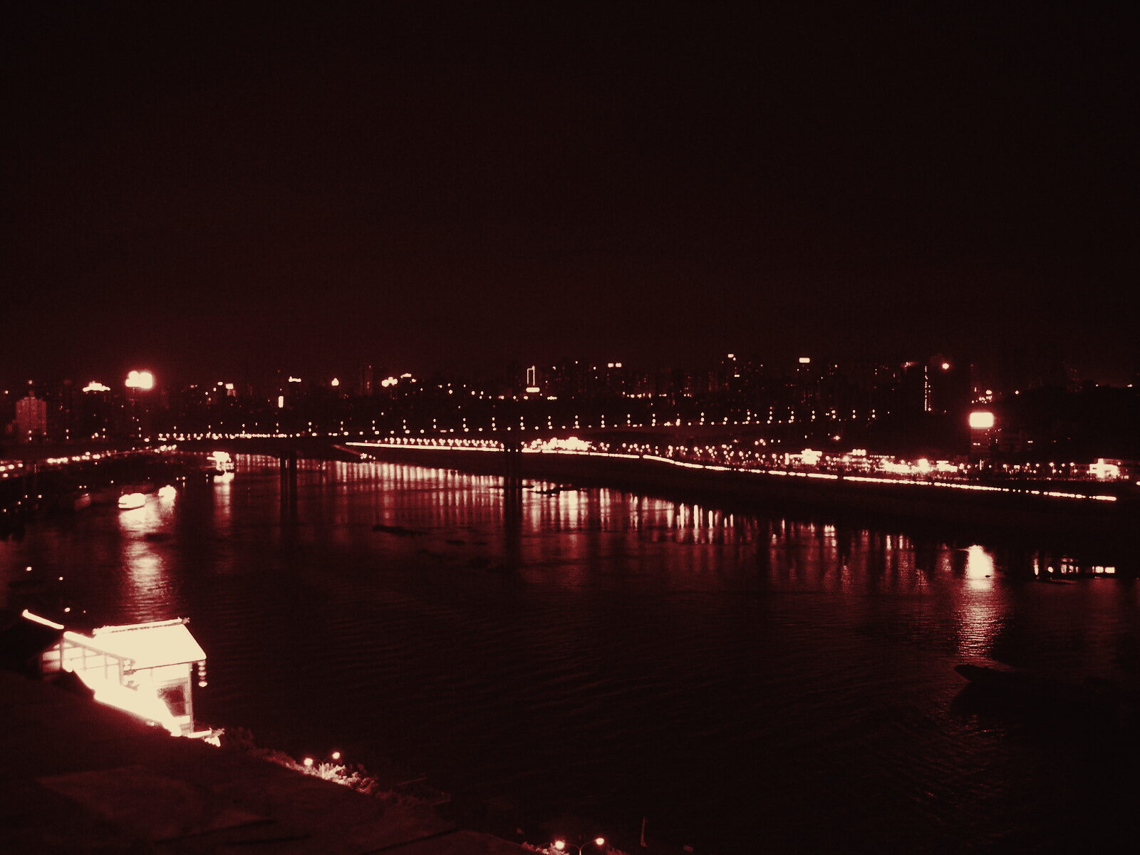 Night view across the rivers of Chongqing, in duotone grade
