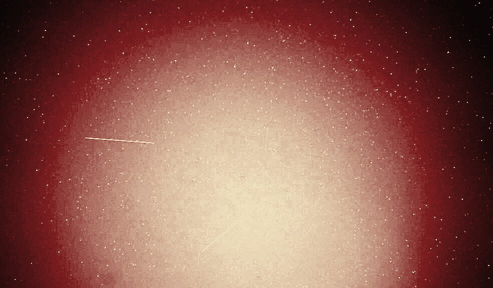 The Tiangong space station streaking across a star field in a long-exposure film still